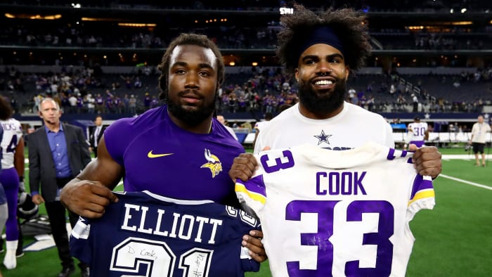 Nov 10, 2019; Arlington, TX, USA; Dallas Cowboys running back Ezekiel Elliott (21) poses for a photo after exchanging jerseys with Minnesota Vikings running back Dalvin Cook (33) at AT&T Stadium. Mandatory Credit: Matthew Emmons-USA TODAY Sports